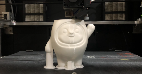 3D printer printing white miniature