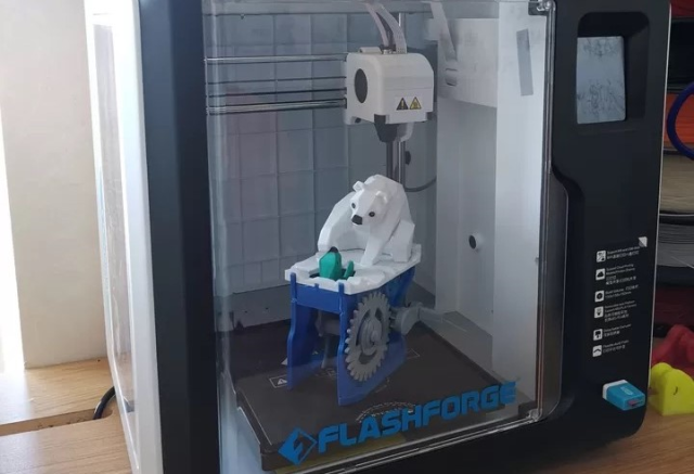 3D printer for makers with 3D printed bear inside